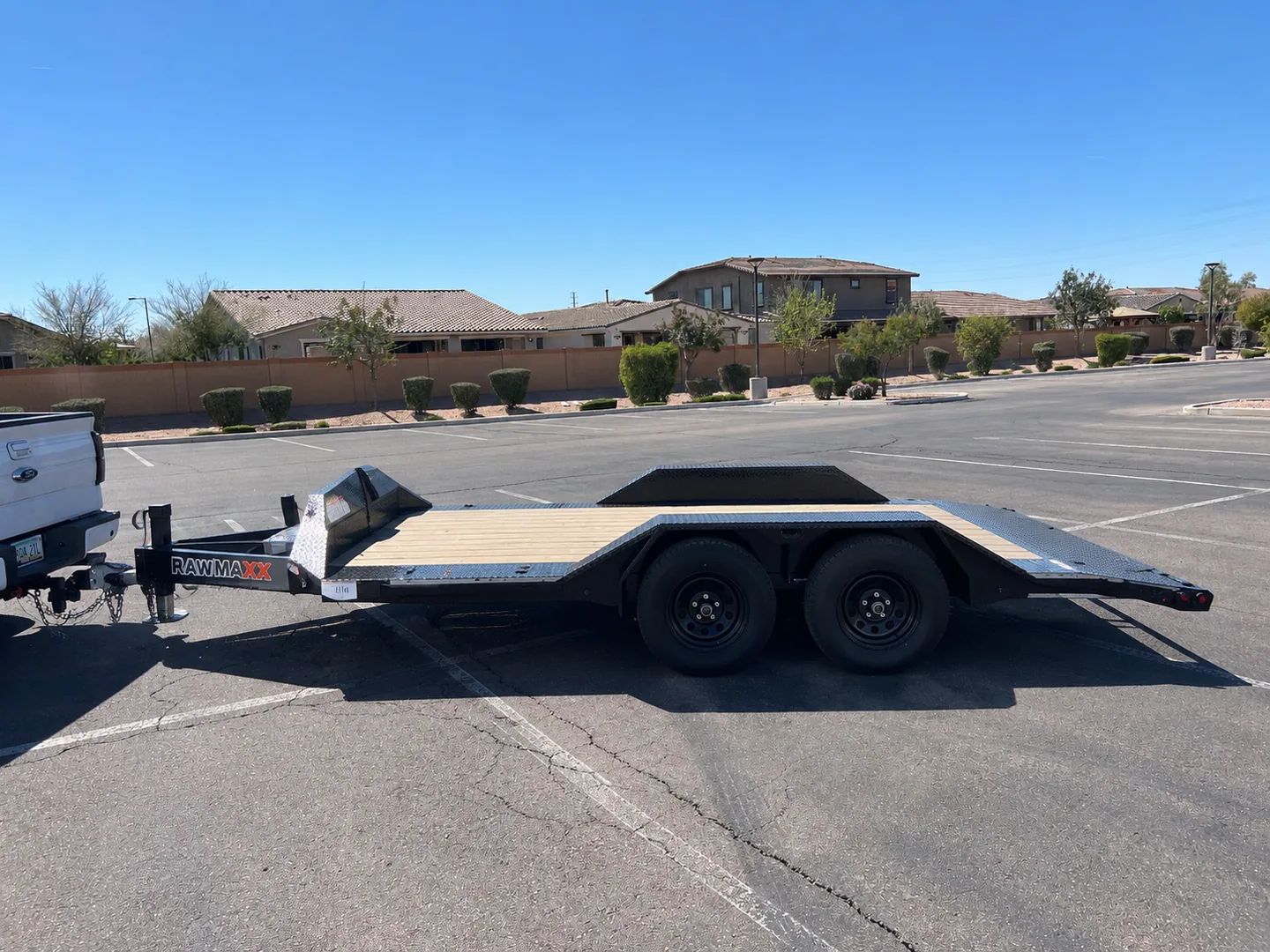 RawMaxx SLX side profile showing the long deck and tandem axles
